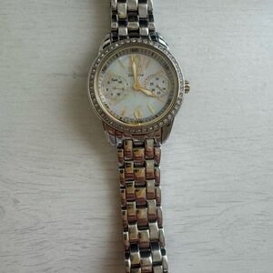 SOLD ON MERCARI Citizens Women’s Watch Silver with Gold accents
